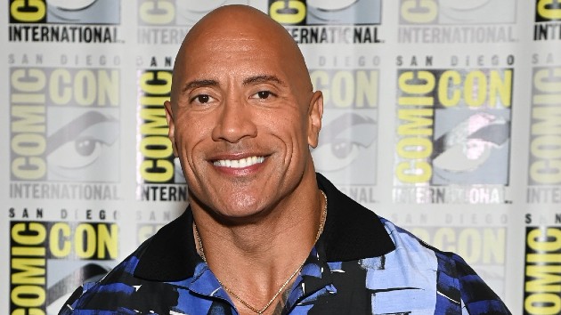 fans-pass-baby-to-dwayne-“the-rock”-johnson-during-‘black-adam’-promotional-event